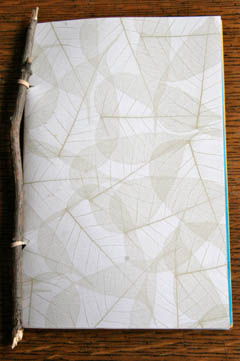 Book made with twig, patterned leaf paper, rubber band
